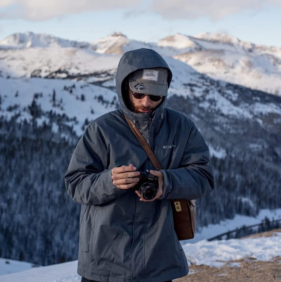 Parker Stroop with camera in the mountains