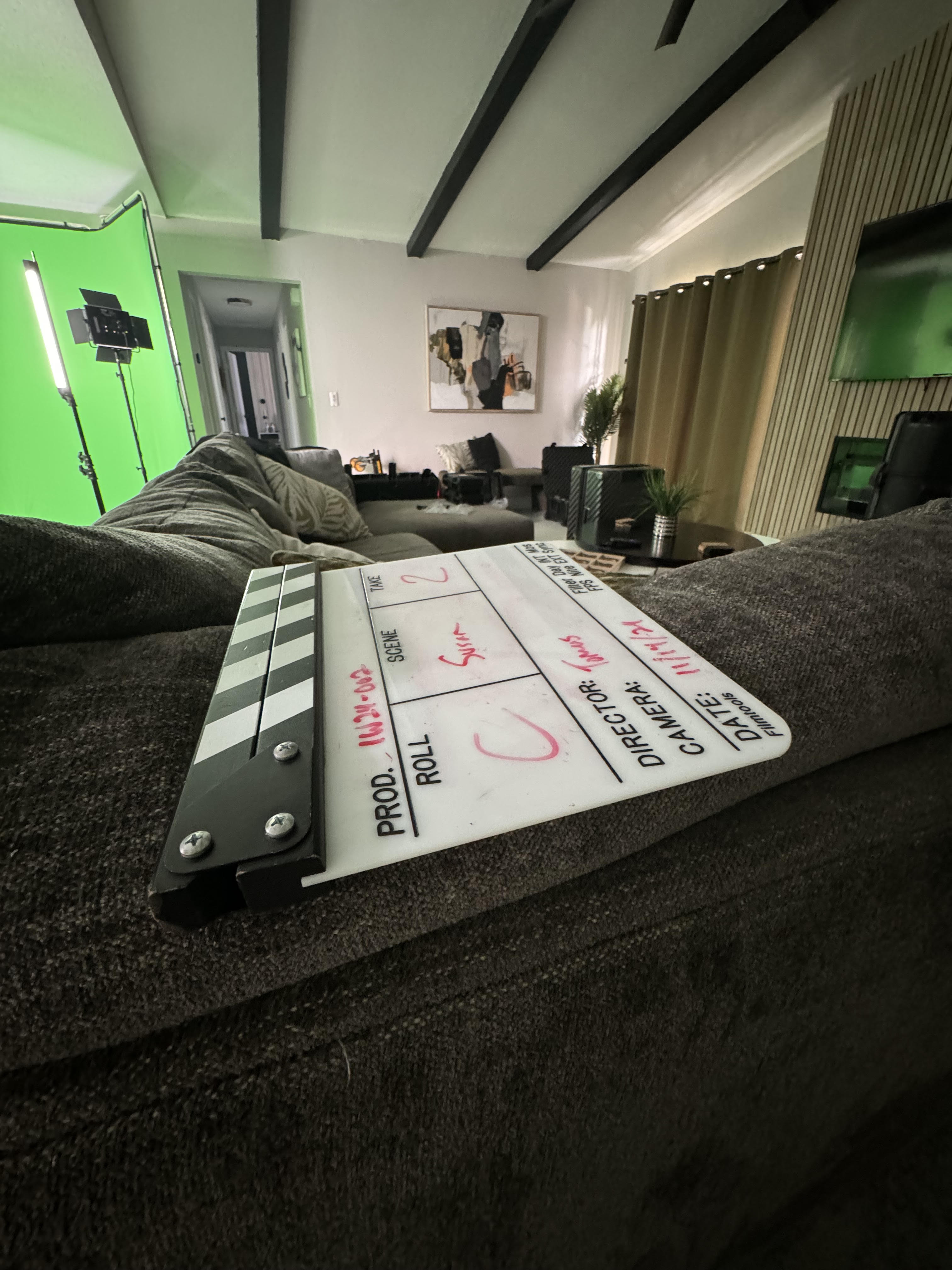 Film slate on set with green screen